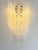 Elegant and contemporary “Conchiglie” wall sconce in Gold 24k finishing. Very bright and lively Murano glass for luxury...