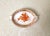 This rare miniature twin-handled porcelain tray, handcrafted by Herend Hungary in the beloved Chinese Bouquet Rust...