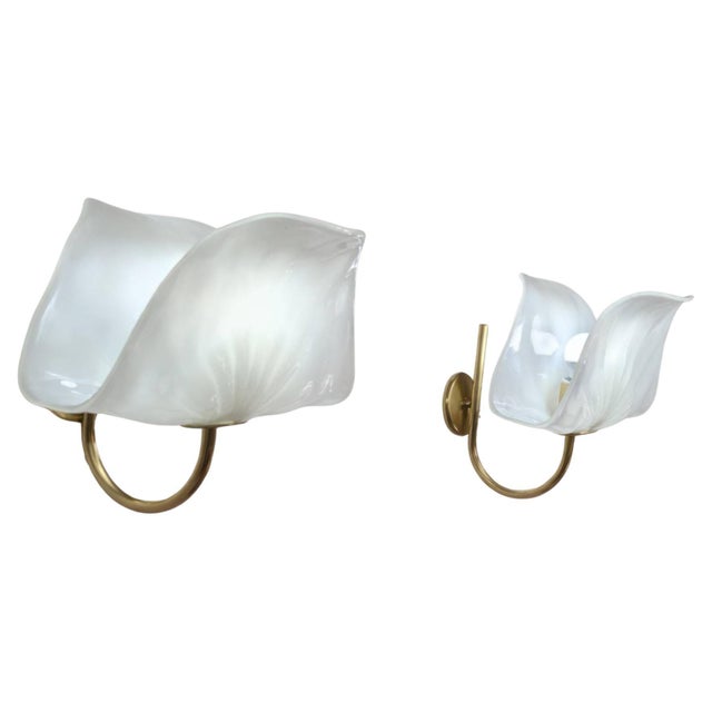 Elegant pair of Italian wall sconces by PAF Studio, produced in the 1970s, combining Murano glass and brass in a refined...