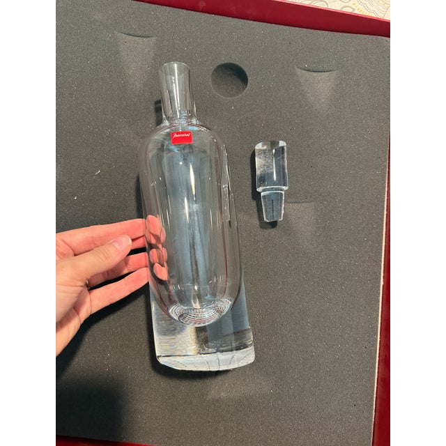 A limited-edition crystal barware set designed by Thomas Bastide for Baccarat, comprising a tall decanter "bottle" and six...