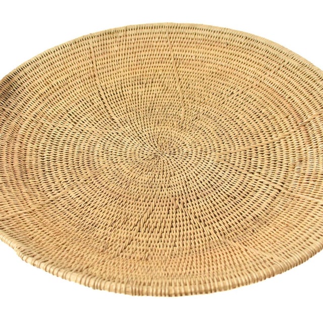 Handwoven Makenge flat wedding basket handmade by the Mbundu women within Zambia. These baskets are traditionally made...