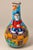Bold, expressive, and full of storytelling charm—this mid-century Italian hand-painted DeSimone vase features a lively...