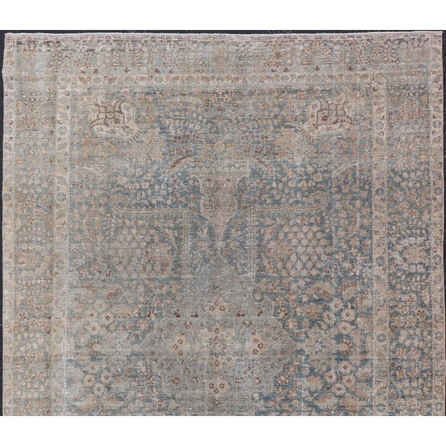 Measures: 6'4 x 9'10 Antique Persian Tabriz Rug with Light Blue Field and Subtle Allover Design. Keivan Woven Arts/...