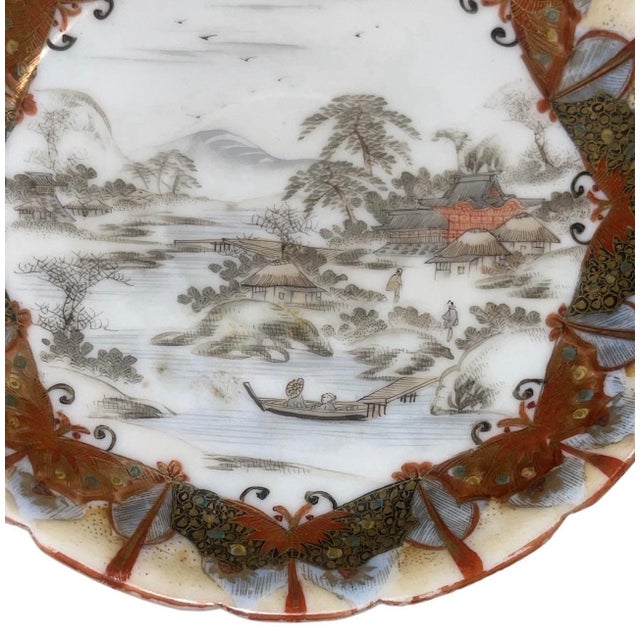 A finely detailed Kutani porcelain plate from the late 19th century, executed during the Meiji period. This small cabinet...