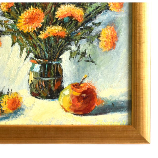 Impressionist floral painting on an artist's stretched canvas displayed in a complementary antiqued gold frame. The...