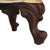 This antique footstool, dating to approximately 1920, features a rectangular upholstered cushion set upon a frame with...