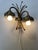 Unfortunately, I haven't been able to find out the designer/manufacturer of this unique, extravagant lamp. Its design is...