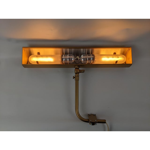 An especially handsome vintage gallery or picture light featuring a substantial 14-inch brass-tone housing and an...
