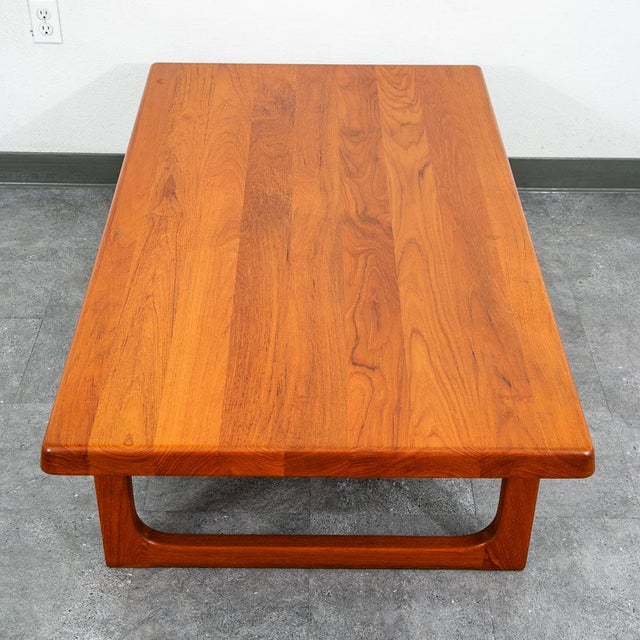 Truly stunning mid century Danish teak sculptural rectangular coffee table. Designed by Danish designer Niels Bach and...