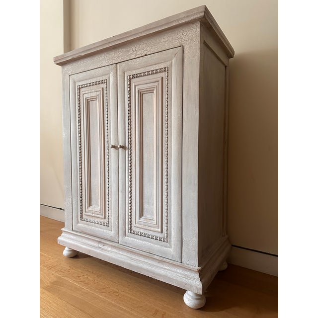 Arhaus Classic Period Cabinet in distressed, farmhouse look. This furniture piece is imperfect, it has natural occurring...