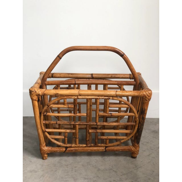 Add this vintage, mid-century, boho piece to your home as a catchall for your mags, rags, or vinyl. This bamboo beauty...