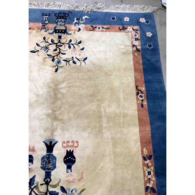 Handmade vintage Art Deco Chinese rug in beige and blue shades. The rug is from the beginning of 20th century in original...