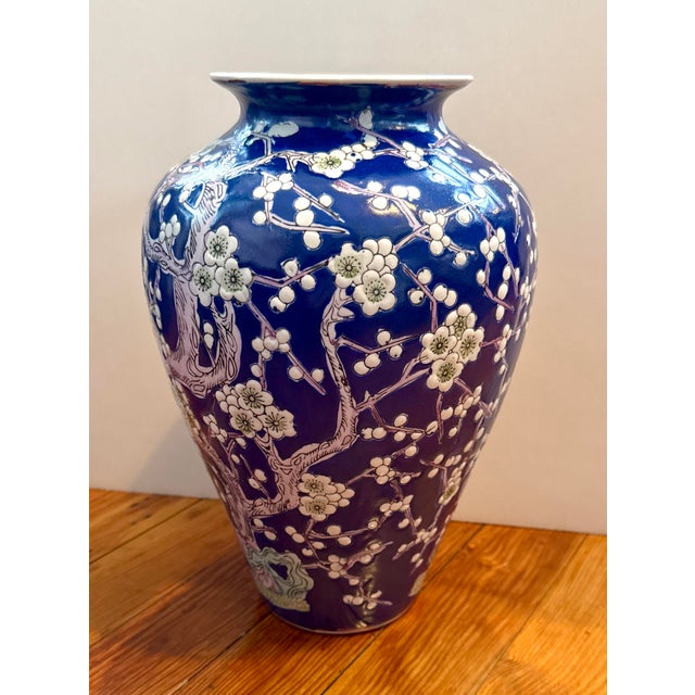 CHINESE BLUE AND WHITE PORCELAIN VASE In the Hawthorne pattern, with light green highlights to flowers and rockery at...