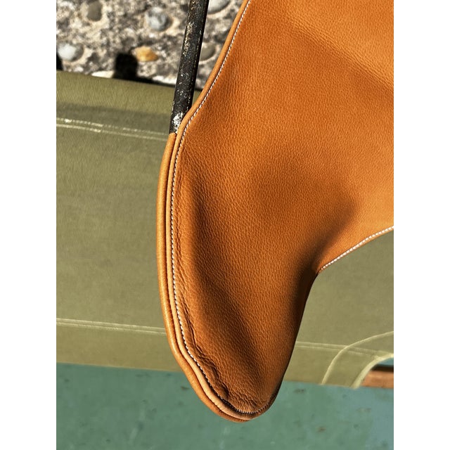 AA Butterfly chair for Airborne, 1950. New cognac leather seat with white saddle stitching. Original frame in good...