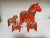 A Dalecarlian horse or Dala horse is a traditional carved, painted wooden statue of a horse originating in the Swedish...