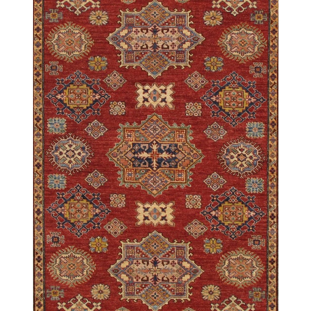 Kazak rugs are famed for their rich colors, assertive, geometric drawing and bold, and large-scale designs. The lustrous...