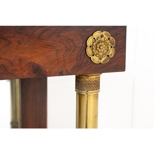 A Fine 19th Century Rosewood Chiffonier with Original Mirrored Back, Brass Mounts and Marble Top. This admirable piece,...