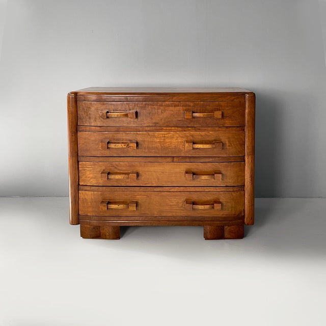 Italian Art Deco chest of drawers in wood, 1930s Wooden chest of drawers. The rounded front features four drawers with...