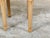 A pair of French neoclassical style bleached wood stools from the early 20th century, with fluted legs and new upholstery....