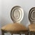 Set of three brushed nickel over steel spiral backed bar stools upholstered in a neutral olive satin crepe fabric. Great...