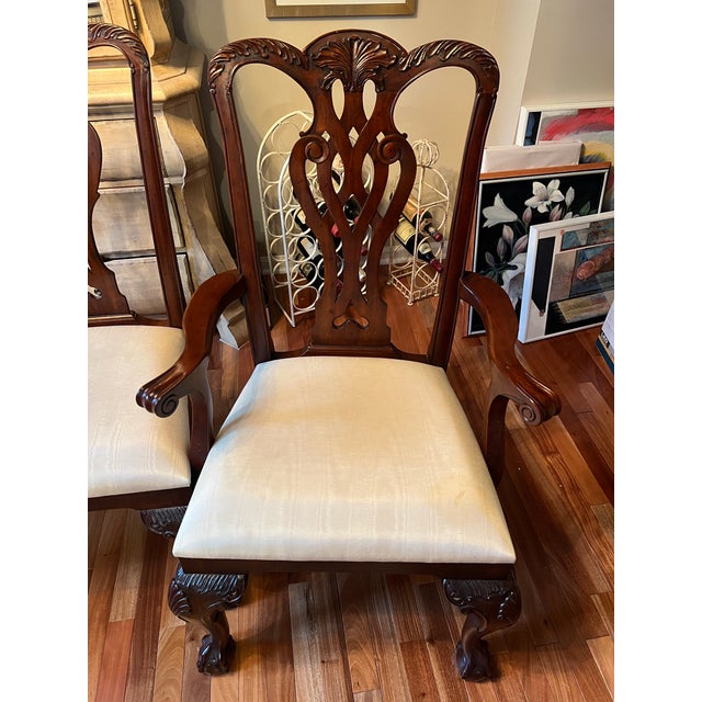 Beautiful set of 4 vintage Maitland Smith dining chairs, including 2 armchairs and 2 side chairs. The chairs feature...