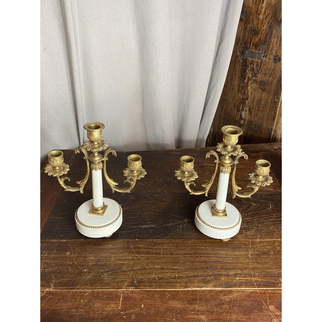 Pair of small three-light candelabra in gilt bronze and white marble. Period: 1880. The mount is in gilt bronze (chased...