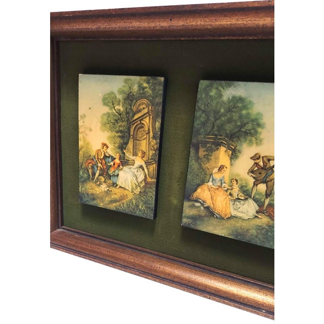2 courting couple / family scenes on a background of green velvet/velour. The scenes are in muted tones. The frame is a...