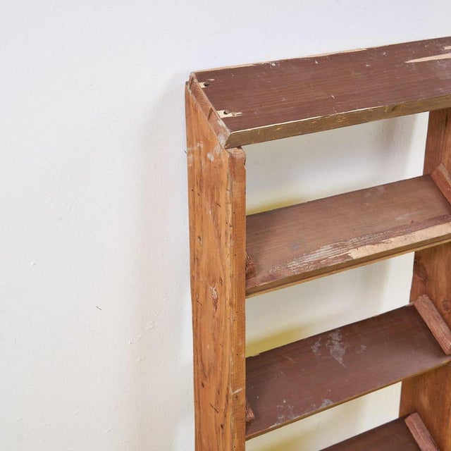 This vintage wooden ladder is a perfect example of functional, retro design. With a sturdy frame and four shelves, it's...