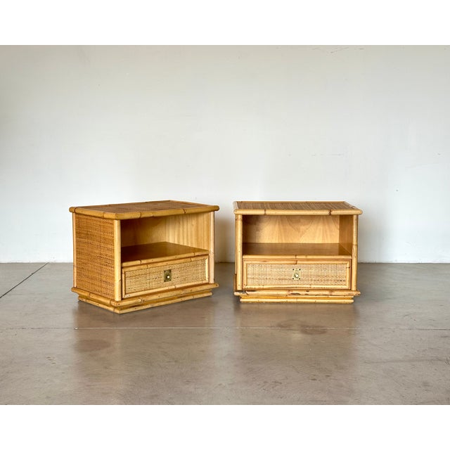 Pair of wicker and bamboo bedside tables from the 1970s produced by the Italian company Dal Vera This piece has an...