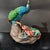 Ceramic 1. **Hand-Painted Ceramic Peacock Statue, Blue-Green-Yellow-Red Plumage, Floral Base** For Sale - Image 7 of 7