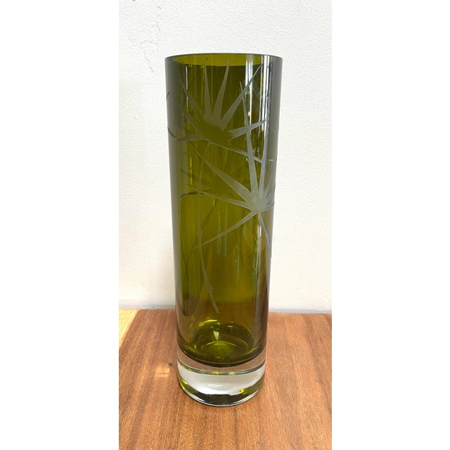 Beautiful with or without flowers, this cylinder shape olive color glass vase will add a touch of sophistication to your...