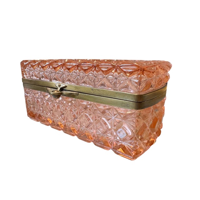 A beautiful antique Continental pressed glass jewelry casket, crafted in richly molded blush pink glass and mounted in a...