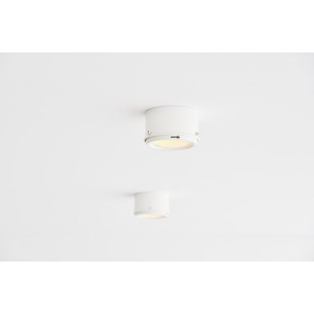 Set of 2 ceiling lamps model 3055 designed by gino sarfatti and manufactured by arteluce, italy 1962. Body is in white...