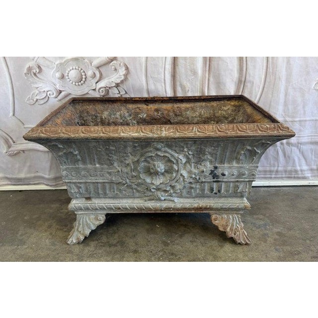 An exceptional and highly decorative antique French cast iron jardinière, or rectangular planter, embodying the timeless...