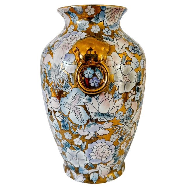Vintage Chinese export porcelain vase featuring an all-over gilded ground and decorated with raised polychrome enameling...