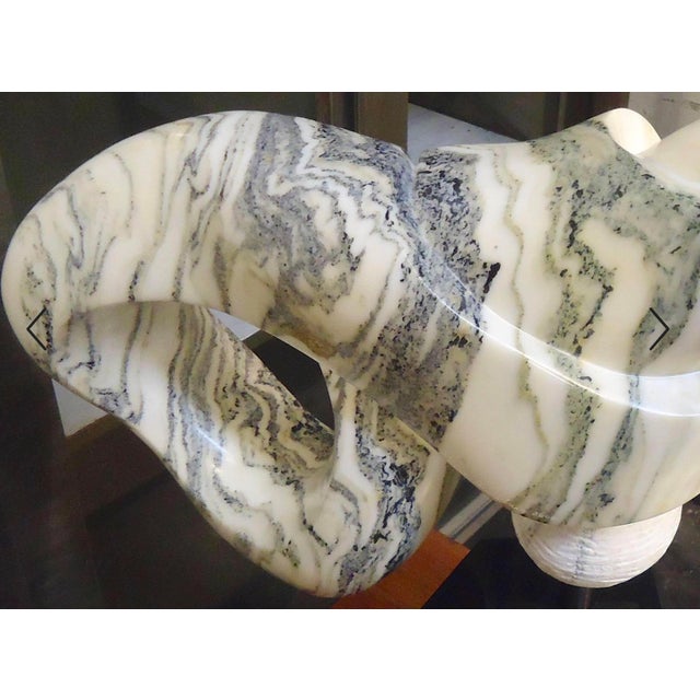 Beautiful sculpted marble artwork in the shape of a bow or infinity symbol. Signed by the American artist Sharon...