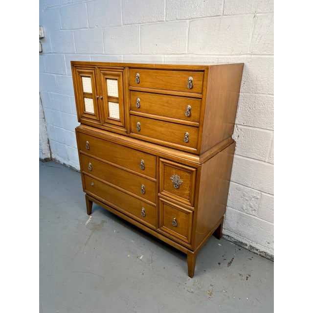 Beautiful and unique mid-century modern highboy dresser by National of Mt. Airy featuring a striking combination of warm...