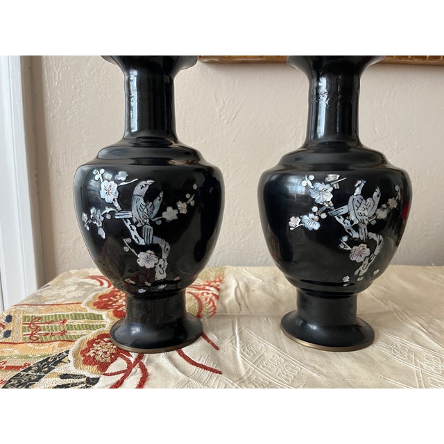 This is a stunning pair of vintage Korean cloisonné-style brass vases, featuring a high-gloss black enamel finish. Each...