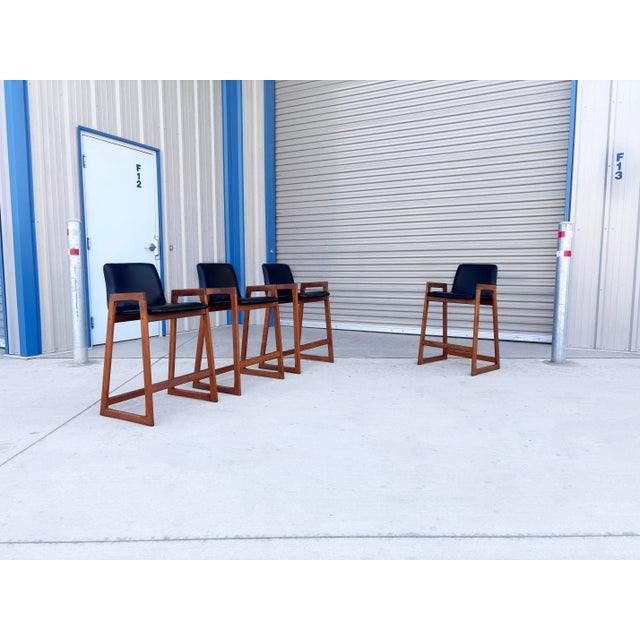 ✨ Mid-Century Modern Teak Bar Stools, Set of 4 ✨ This stunning set of four mid-century modern bar stools was designed and...