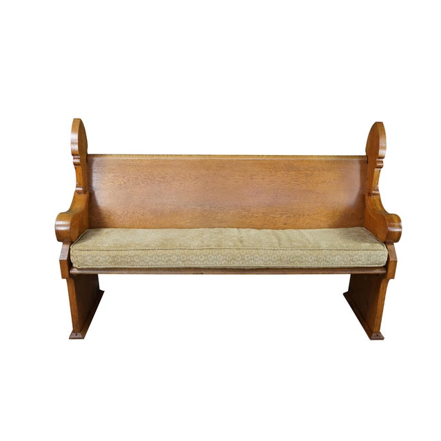 This pair of antique Victorian Gothic Revival church pews is crafted from premium quartersawn oak, showcasing a prominent,...