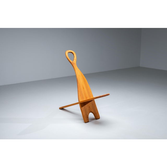 This slender highback chair explores the relationship between line, form, and balance through a strikingly simple...