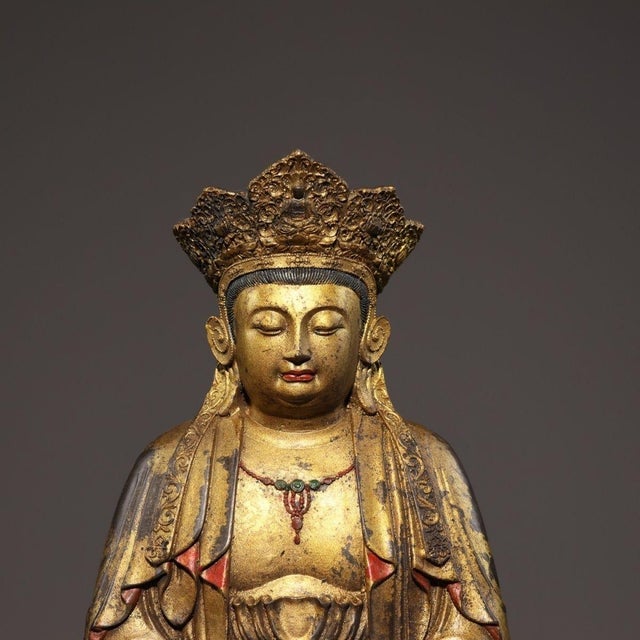 This is a magnificent Chinese gilt bronze sculpture of Guanyin (Avalokitesvara), the Bodhisattva of Compassion. The deity...