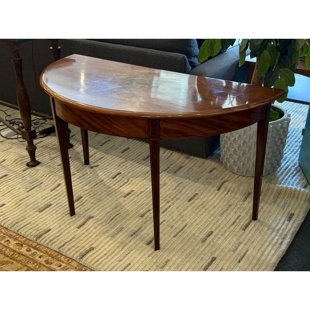 Design Plus Gallery presents a Demi-Lune Mahogany Console Table in the George III Style. This console table is similar to...