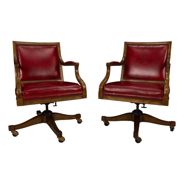 Pair of 1980s Baker Furniture Rolling Executive Chairs in Carved Wood & Burgundy Vinyl Upholstery For Sale