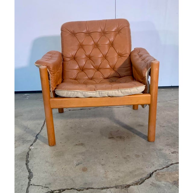 An exquisite vintage leather safari armchair designed by Kjell Nordin in the 1980s, part of the iconic IREVIK collection...