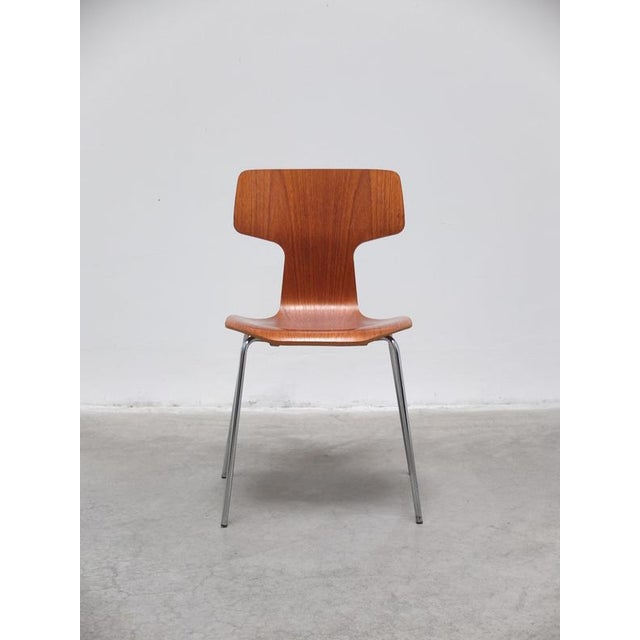 ‘Hammer’ chair designed by Arne Jacobsen in 1955. Early model made of teak wood produced by Fritz Hansen in 1983. This...