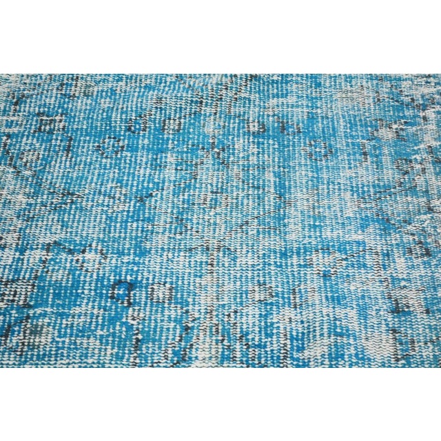 Hand-knotted with care using traditional rug making techniques, this wool rug blends timeless craftsmanship with a modern...