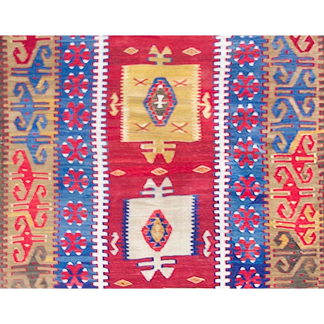 A stunning early 20th century Turkish Konya kilim rug with a fantastic bold tribal pattern containing two large stylized...