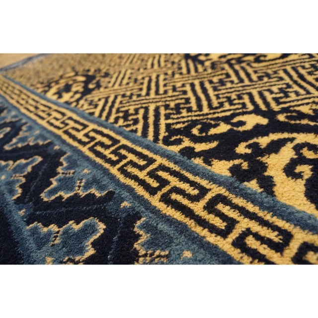 Blue Wool Antique Rectangle Hand Knotted Pile 1920s Rug, Circa Date: 1920s. This exquisite piece exemplifies the refined...