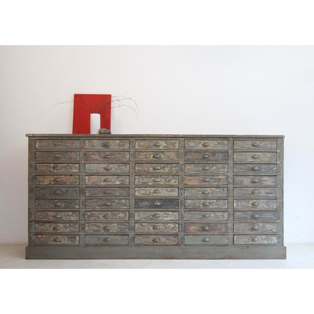 Large workshop drawer cabinet from the first half of the 20th century. Crafted from solid pine with an excellent original...